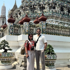 Couple posing in front of temple 