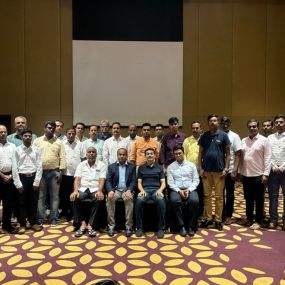 People posing together in hall
