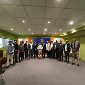 A team proudly posing for a photo 