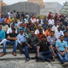 Group of people seating and  posing together