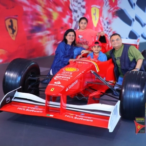 A family photo with f1 car