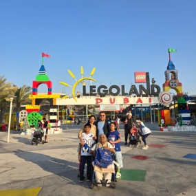 Family posing together in front of LEGOLAND Dubai