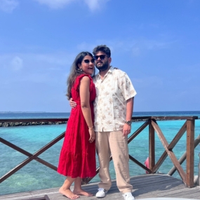 Couple clicking photo standing on a dock