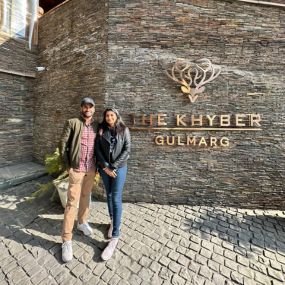 Couple posing at The Khyber Resort, Gulmarg entrance.