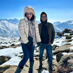 Two people posing on a rocky